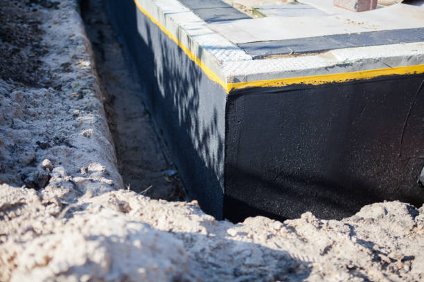 Professional Emergency Waterproofing technician working in Dowling, MI